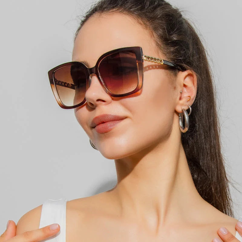 Luxury oversized square sunglasses for women with a sturdy alloy frame and gradient, mirrored lenses that offer UV protection and reduce glare.