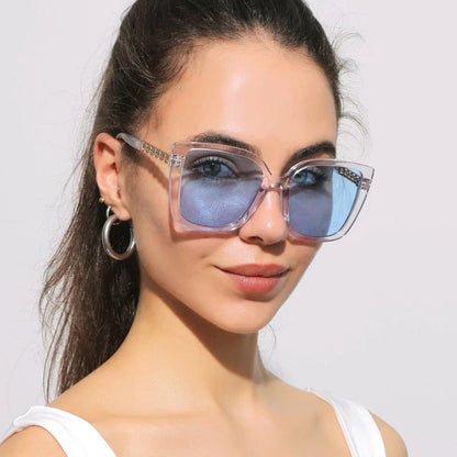 Luxury oversized square sunglasses for women with a sturdy alloy frame and gradient, mirrored lenses that offer UV protection and reduce glare.