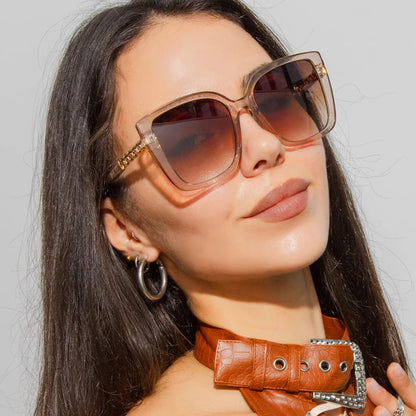 Luxury oversized square sunglasses for women with a sturdy alloy frame and gradient, mirrored lenses that offer UV protection and reduce glare.