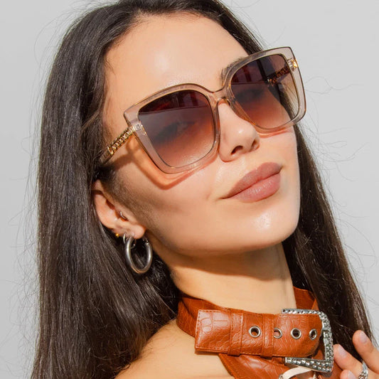 Luxury oversized square sunglasses for women with a sturdy alloy frame and gradient, mirrored lenses that offer UV protection and reduce glare.