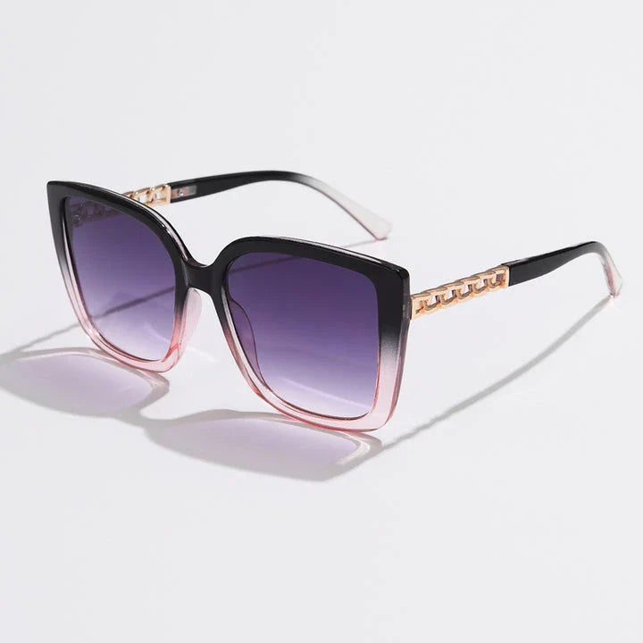 Luxury oversized square sunglasses for women with a sturdy alloy frame and gradient, mirrored lenses that offer UV protection and reduce glare.