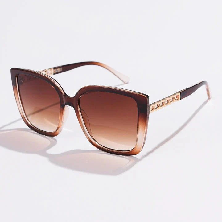 Luxury oversized square sunglasses for women with a sturdy alloy frame and gradient, mirrored lenses that offer UV protection and reduce glare.