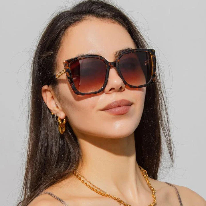 Luxury oversized square sunglasses for women with a sturdy alloy frame and gradient, mirrored lenses that offer UV protection and reduce glare.