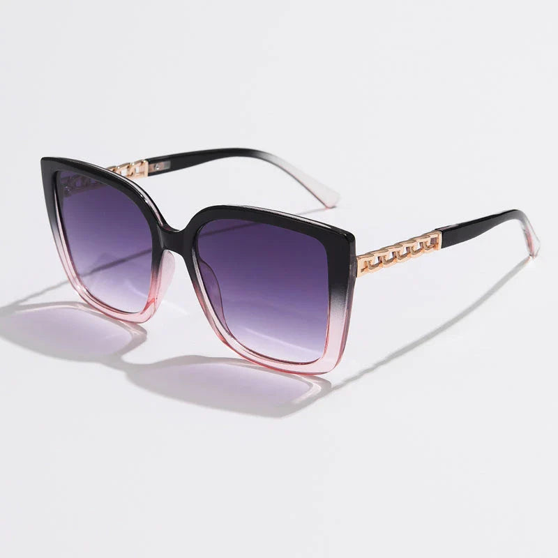 Luxury oversized square sunglasses for women with a sturdy alloy frame and gradient, mirrored lenses that offer UV protection and reduce glare.