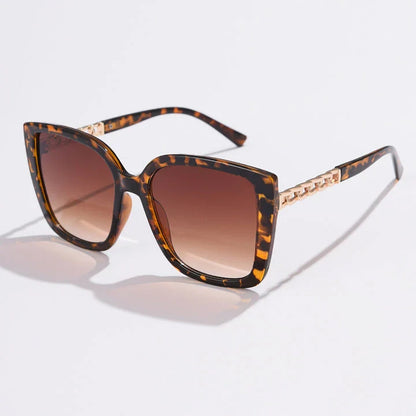 Luxury oversized square sunglasses for women with a sturdy alloy frame and gradient, mirrored lenses that offer UV protection and reduce glare.