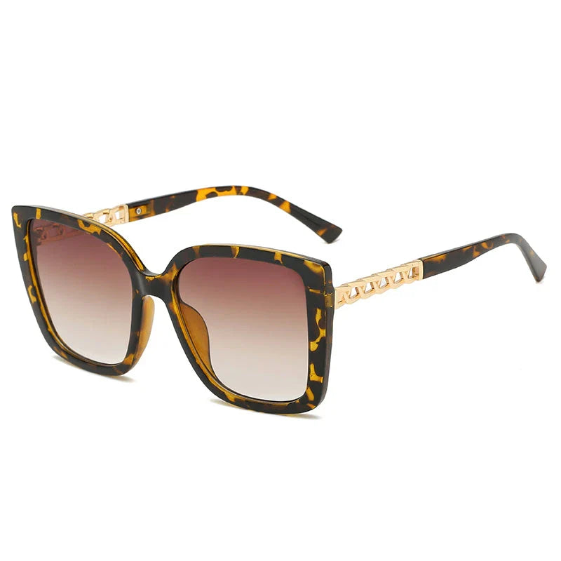 Luxury oversized square sunglasses for women with a sturdy alloy frame and gradient, mirrored lenses that offer UV protection and reduce glare.