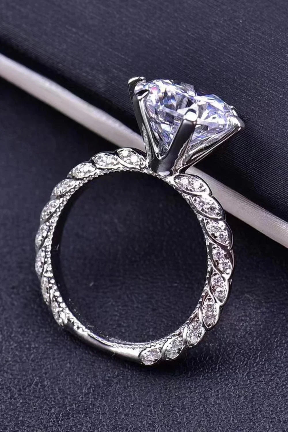 Elegant forever love side stone moissanite ring with a 5-carat center stone and a sleek, platinum-plated band
