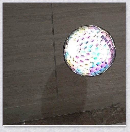 Luminous soccer ball night light that glows and creates hologram effects under camera flash