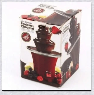3-tier chocolate fondue fountain cascading with rich, melted chocolate, perfect for dipping fruits, marshmallows, cookies, and more