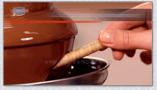 3-tier chocolate fondue fountain cascading with rich, melted chocolate, perfect for dipping fruits, marshmallows, cookies, and more