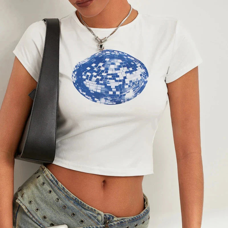A white t-shirt with a vibrant floral and disco ball print, perfect for adding a fun twist to your summer wardrobe.