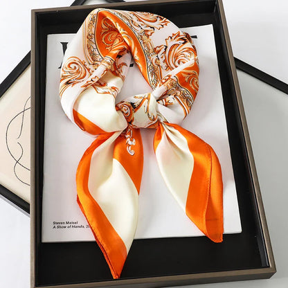 Chic Silk Square Scarf in orange color with whimsical cat print design, a luxurious and versatile fashion accessory.
