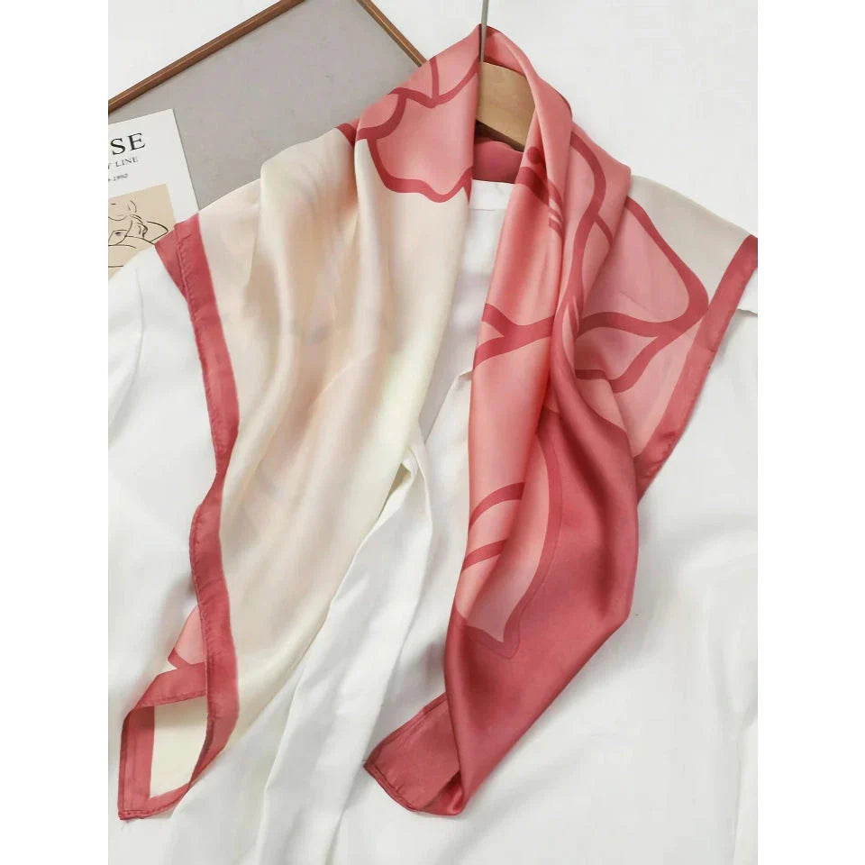 Chic Silk Square Scarf in orange color with whimsical cat print design, a luxurious and versatile fashion accessory.