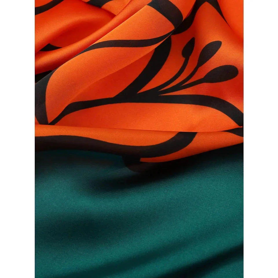 Chic Silk Square Scarf in orange color with whimsical cat print design, a luxurious and versatile fashion accessory.