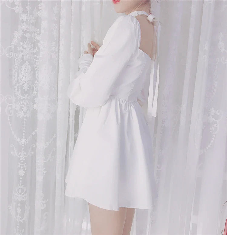 A beautiful white dress with a micro-bubble shoulder line, voluminous lantern sleeves, and a fluffy ballet skirt, perfect for adding a touch of French vintage elegance to your wardrobe.