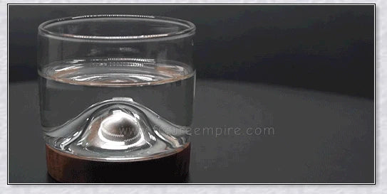 Wooden Mountain Whiskey Glass with a charming mountain silhouette design and natural wooden tray