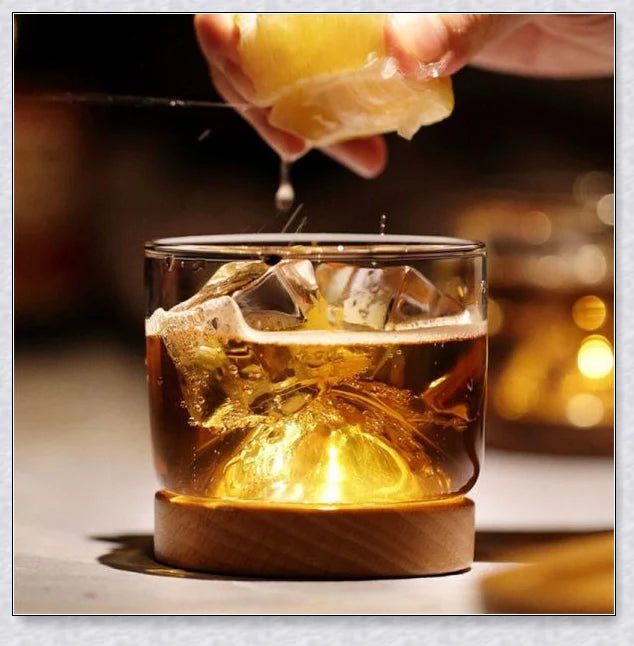 Wooden Mountain Whiskey Glass with a charming mountain silhouette design and natural wooden tray