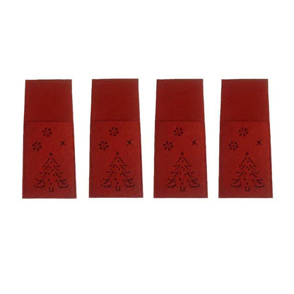 Festive cloth cutlery bags in a holiday pattern, used to neatly organize and serve silverware at a Christmas dinner table