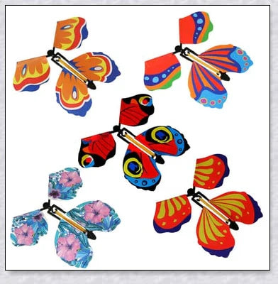A group of colorful magic flying butterflies released from a greeting card or book, creating a whimsical and enchanting surprise