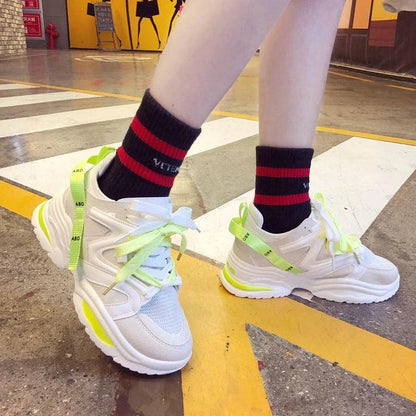 Trendy mesh couple shoes with a breathable design, flexible rubber sole, and stylish color-matching pattern