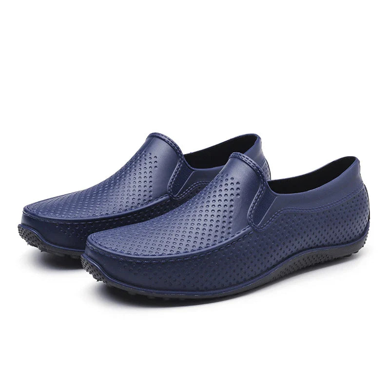 Men's Simple Casual PVC Short Rain Boots in black, with a flat, non-slip sole and round toe shape for comfortable, waterproof protection.