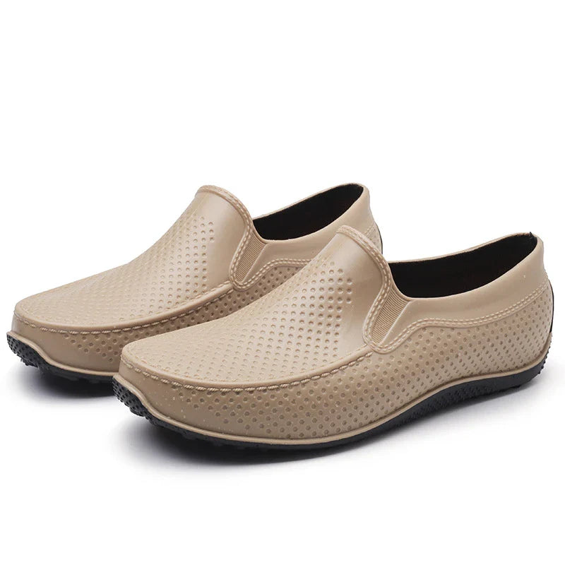 Men's Simple Casual PVC Short Rain Boots in black, with a flat, non-slip sole and round toe shape for comfortable, waterproof protection.