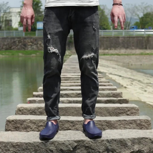 Men's Simple Casual PVC Short Rain Boots in black, with a flat, non-slip sole and round toe shape for comfortable, waterproof protection.