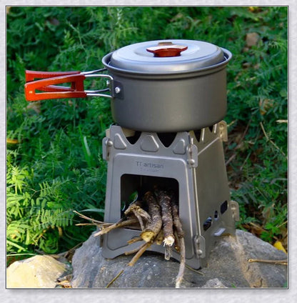Portable titanium camping stove with folding design and open flame for cooking with natural fuels in the outdoors