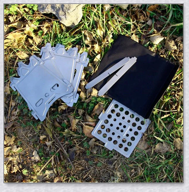 Portable titanium camping stove with folding design and open flame for cooking with natural fuels in the outdoors