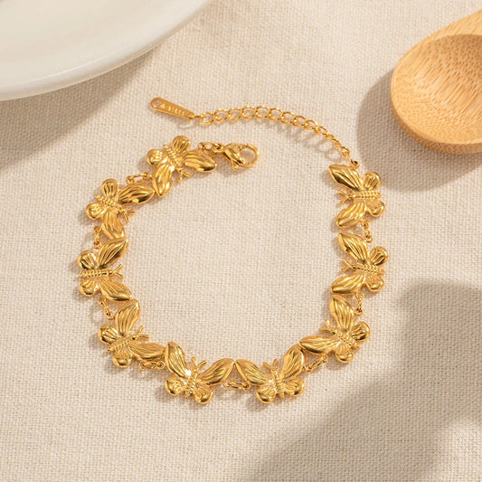 18K gold plated stainless steel bracelet with delicate butterfly pattern and fine polishing