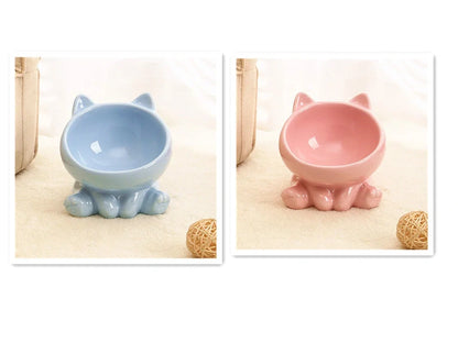 Black and white ceramic cat bowl with oblique mouth and neck guard for reduced whisker fatigue