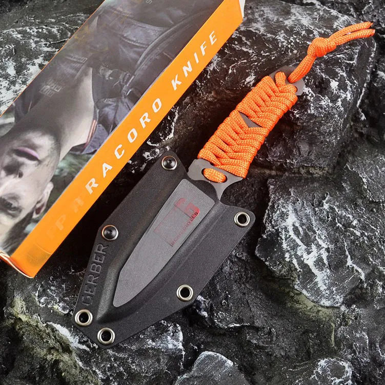 Outdoor survival knife with straight blade, rope-bound handle, and black ABS sheath on grey background