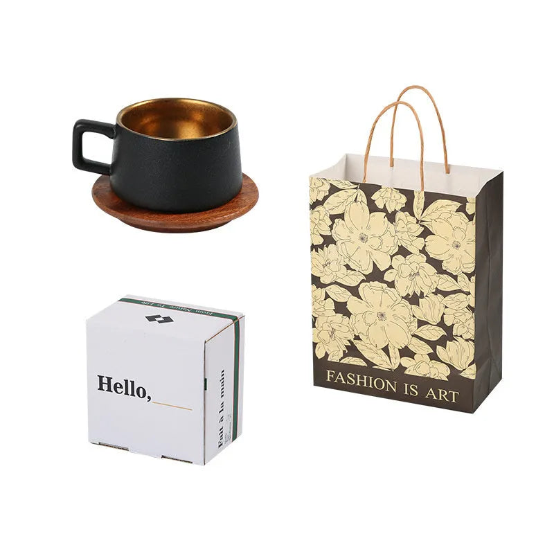 Office gift set showing stainless steel travel tumbler inside a gold-plated presentation box with optional gift bag.