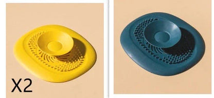 TPR vortex design sink drain cover in twilight orange, quiet blue, mango yellow, and gentian green