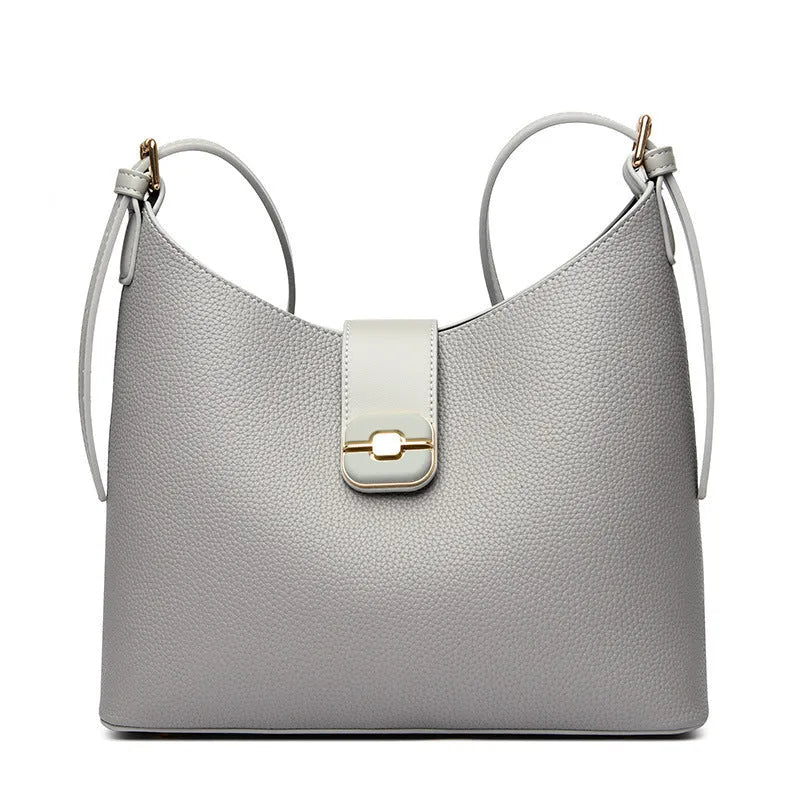 PU bucket shoulder bag in biscuit colour showing internal phone compartment and zippered sections