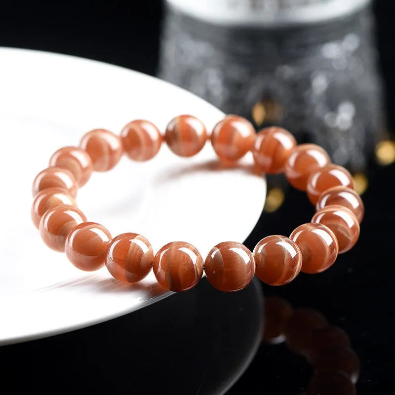 Natural old mine rhodochrosite bracelet with round geometric beads showing manganese spar colour variations