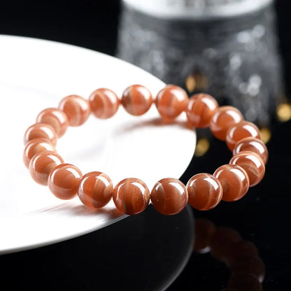 Natural old mine rhodochrosite bracelet with round geometric beads showing manganese spar colour variations
