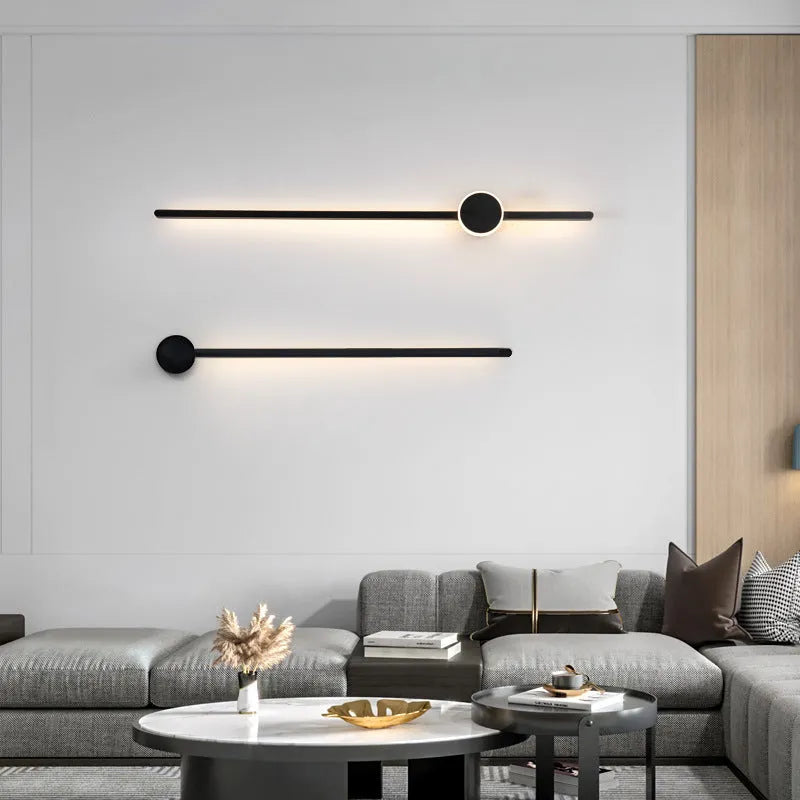 Modern strip wall lamp with acrylic shade mounted beside bed