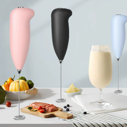 Green electric milk frother measuring 21cm tall with 5cm base creating milk foam