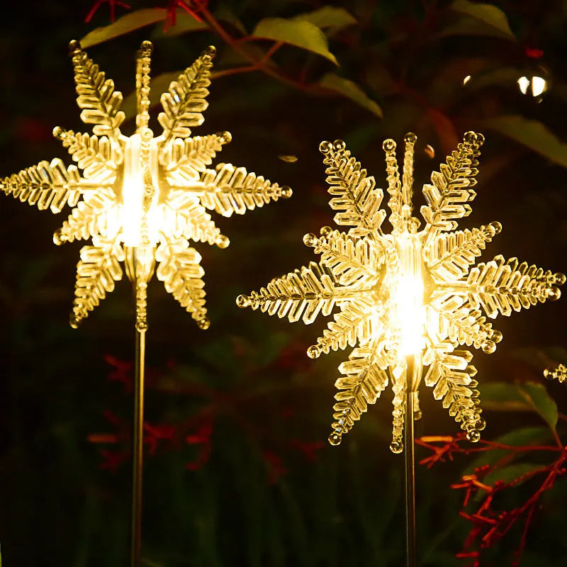 LED solar snowflake garden light with flower-shaped head, warm light, and 2V 100mA solar panel for outdoor lawn use