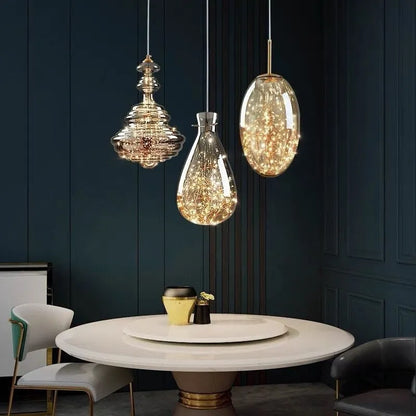 Modern adjustable glass droplight chandelier with LED lighting on a long suspension cable.