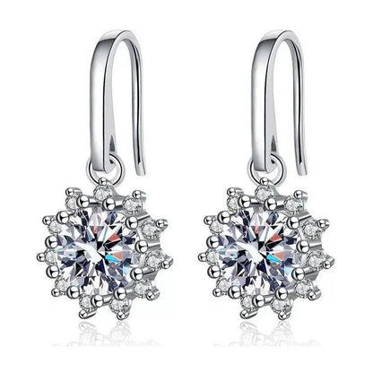 Elegant sunflower-inspired ear cuffs with a gleaming white gold finish, offering affordable luxury and sophisticated style.