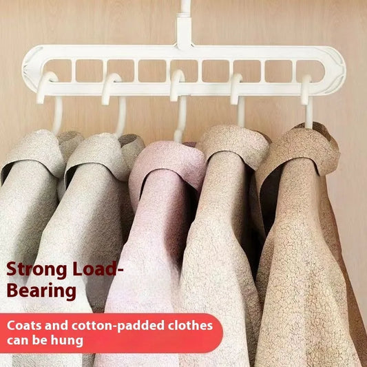 Green nine-hole folding hanger with trousers organised across nine hanging points, showing 45cm width