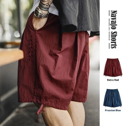 Men's Prussian blue embroidered loose-fit summer shorts on hanger