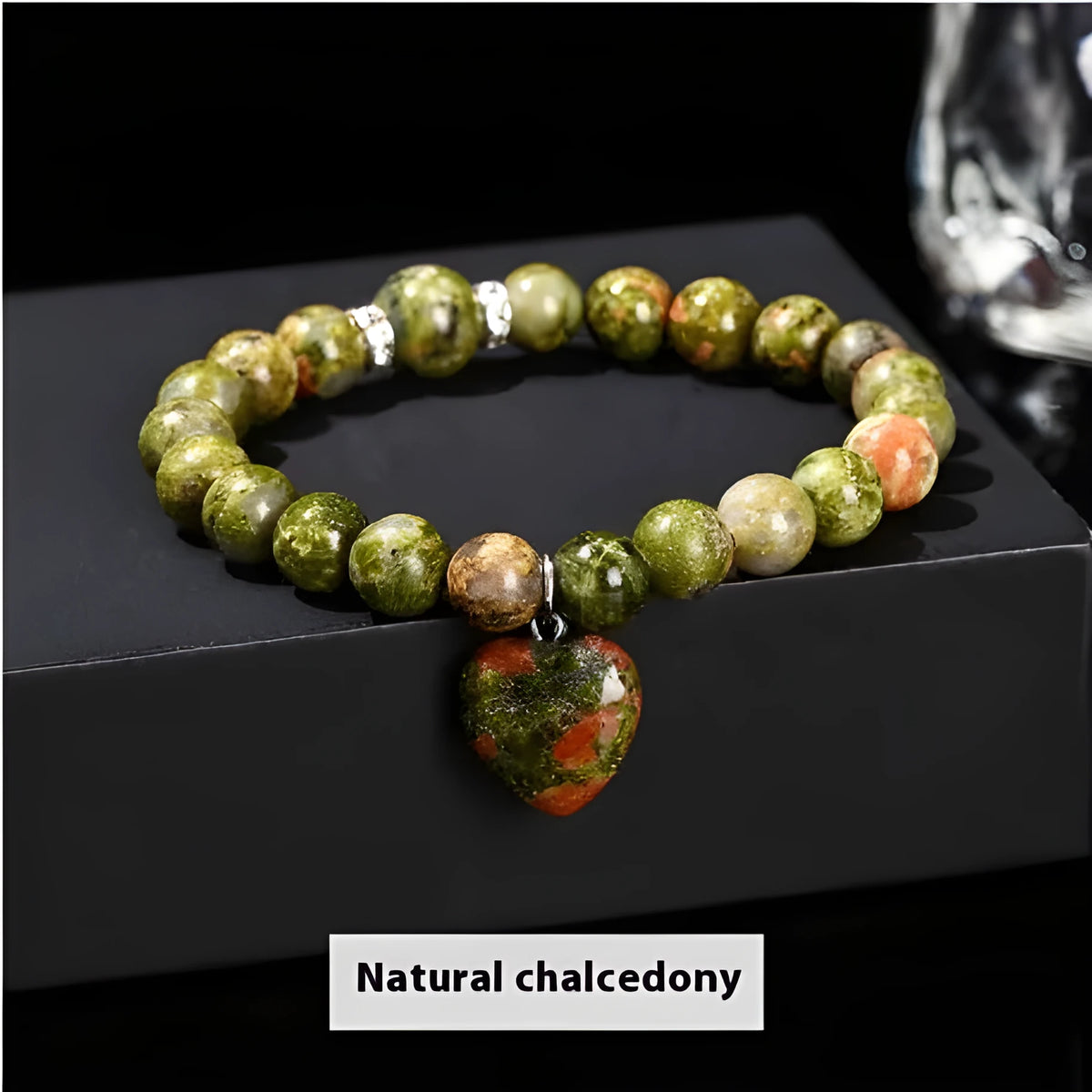 Handmade women's bracelet with natural gemstone beads and a silver love pendant charm.
