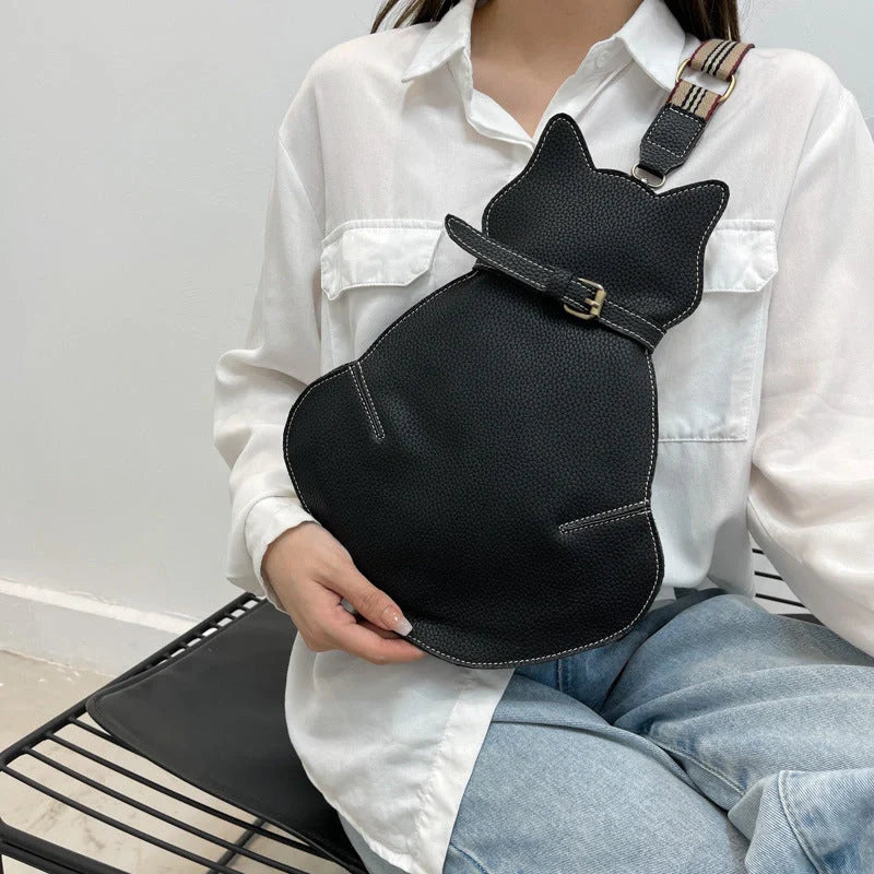 Women's black PU messenger bag with cat design, adjustable strap, and multiple pockets