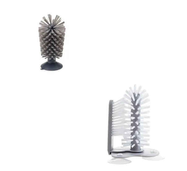 Grey rotating double-head cup brush with suction cups for wall mounting.
