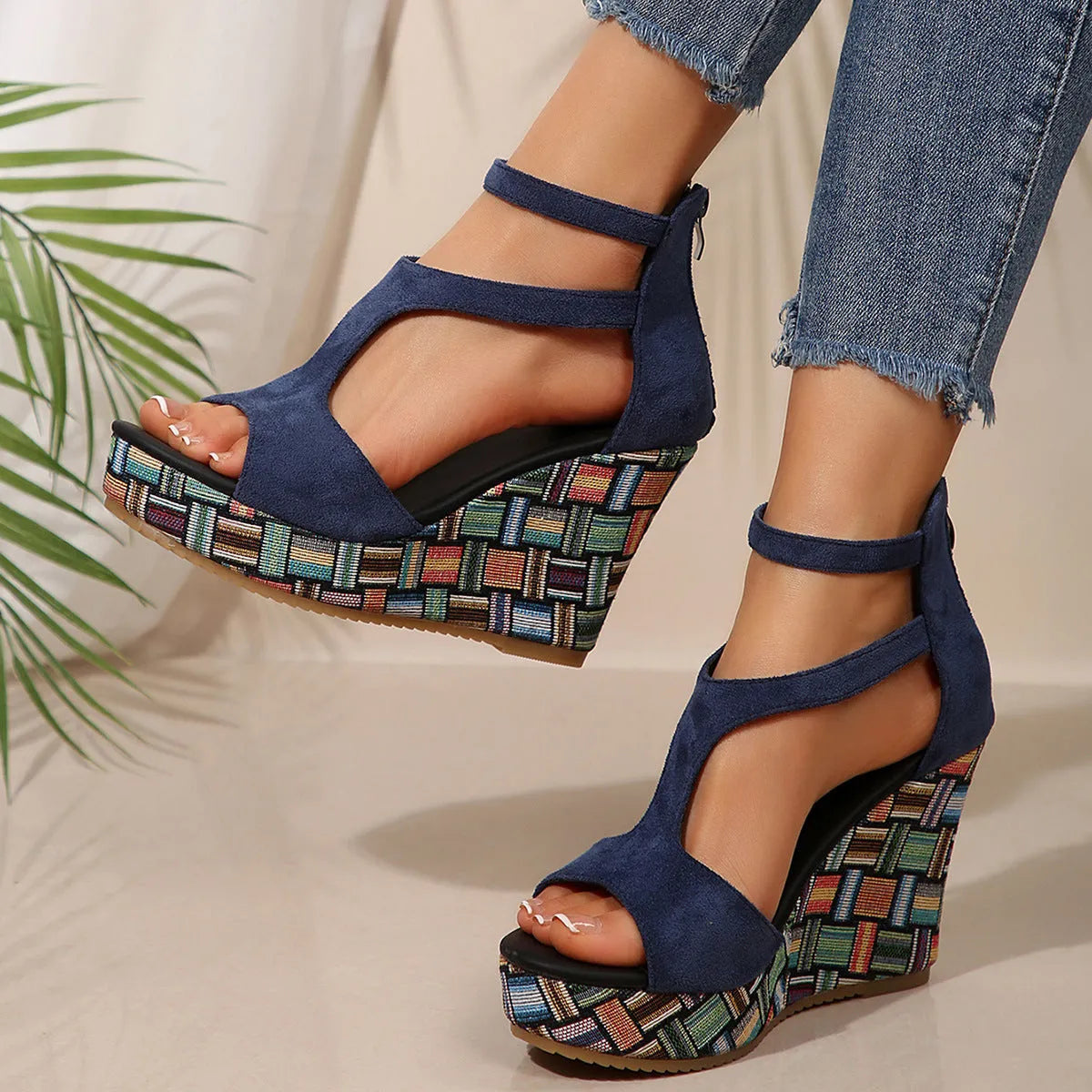 Women's thick-soled ankle-strap buckle sandals in cream white, showing cloth upper and rubber sole.