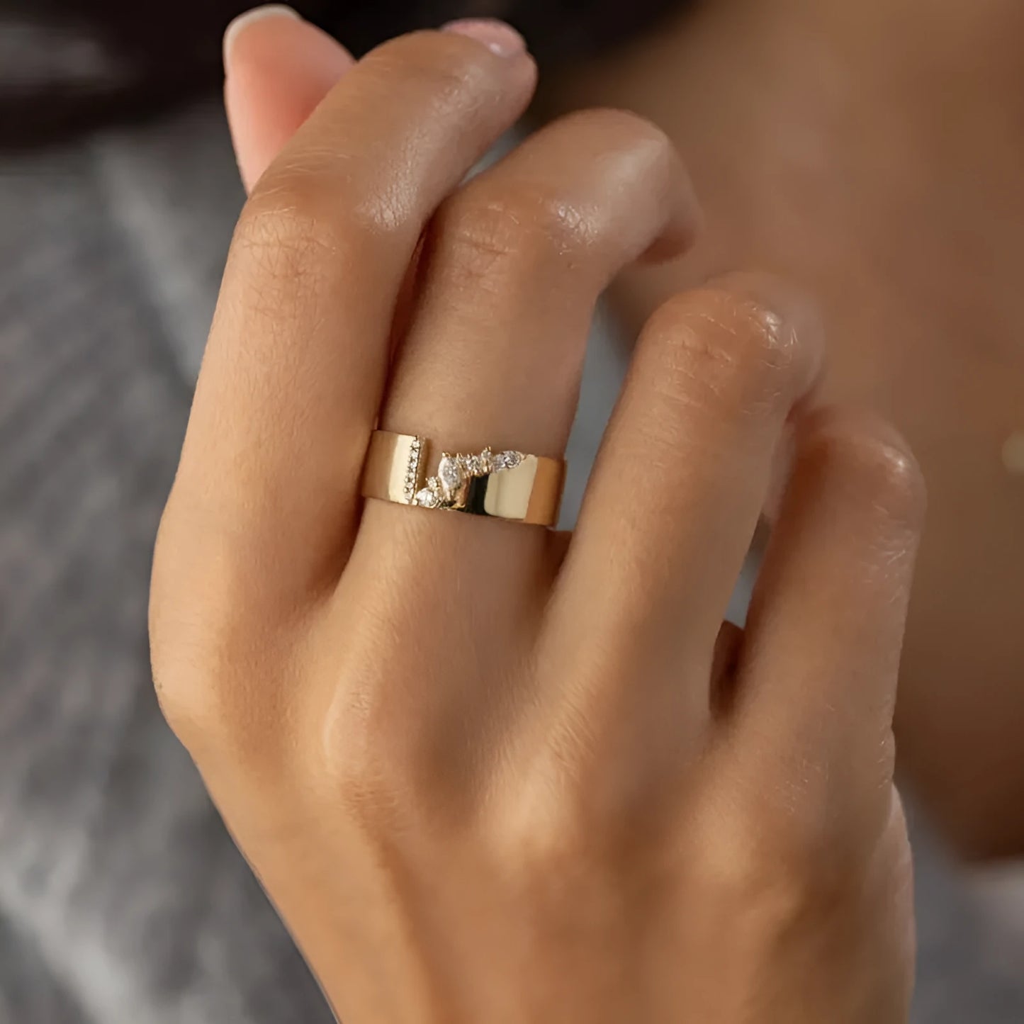 Women's copper ring with electroplated gold finish and shining zircon accents on finger