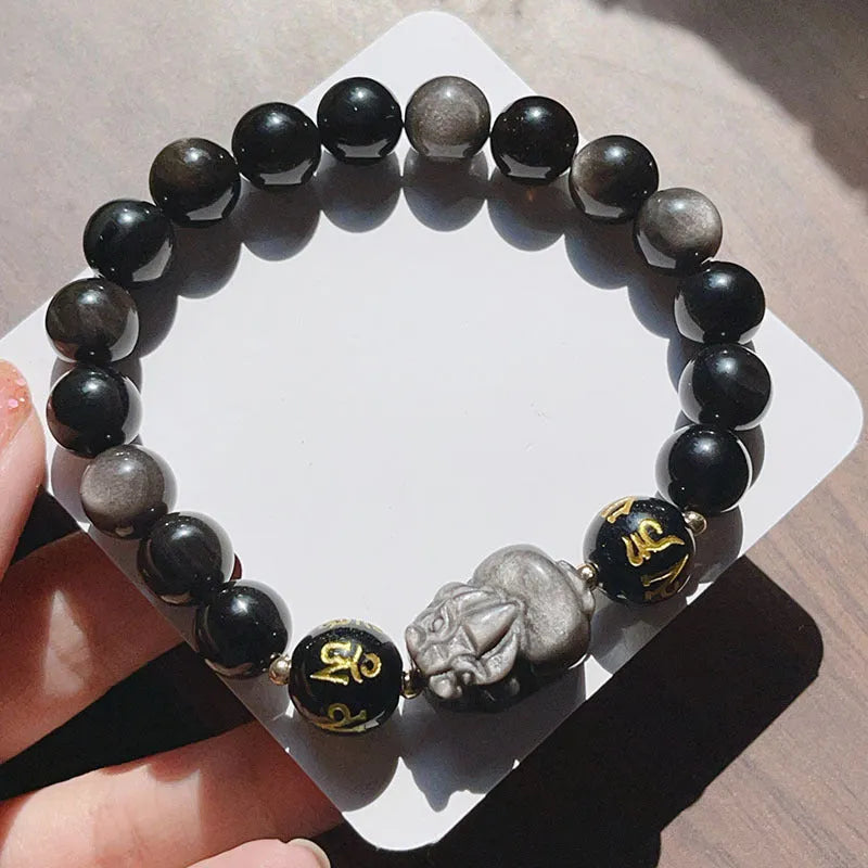 Men's silver stone bracelet with engraved proverb beads and Chinese zodiac style on a wrist.